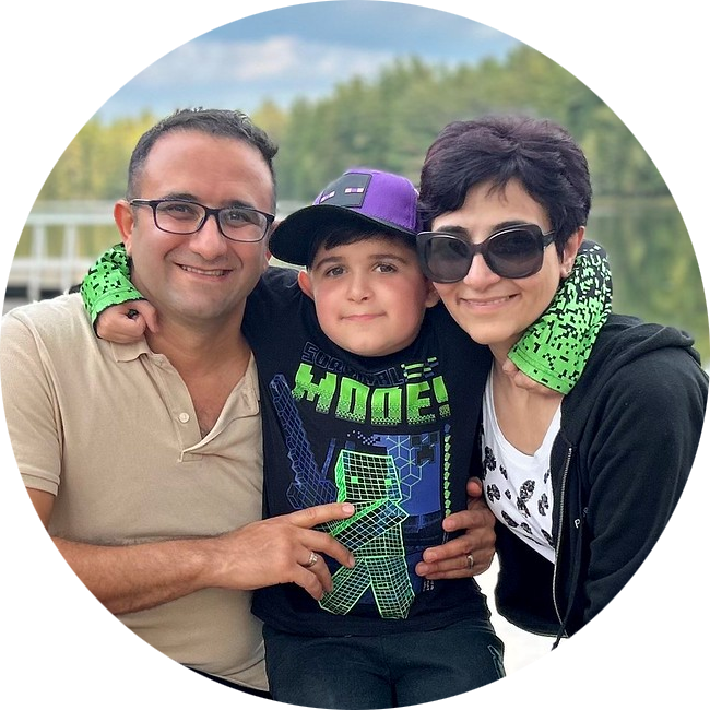 Young boy hugging mum and dad